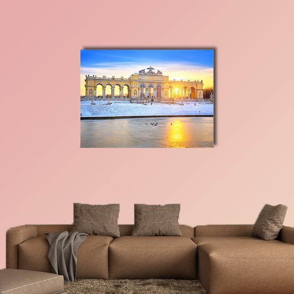 Gloriette in Winter Canvas Wall Art in white, yellow and blue, single panel hung on a wall