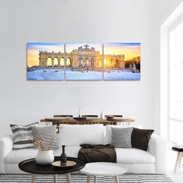 Gloriette at Schönbrunn Palace, Winter Sunset Panoramic Canvas Wall Art in white, yellow and blue, hung on a wall