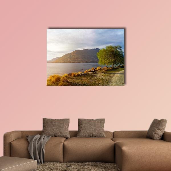 Sunset Over Lake Wakatipu Canvas Wall Art in brown, yellow and blue, single panel hung on a wall