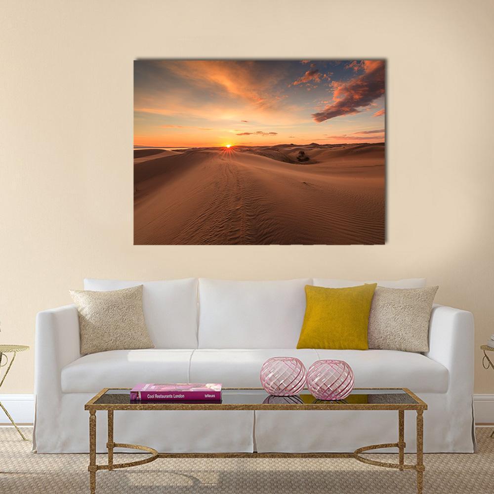 Sunset Over Gobi Desert Dunes Canvas Wall Art in brown, orange and blue, single panel hung on a wall