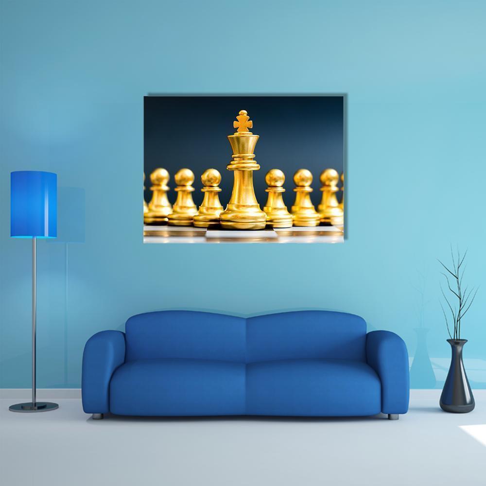 Gold King and Pawns on Chessboard Canvas Wall Art in black, gold and blue, single panel hung on a wall