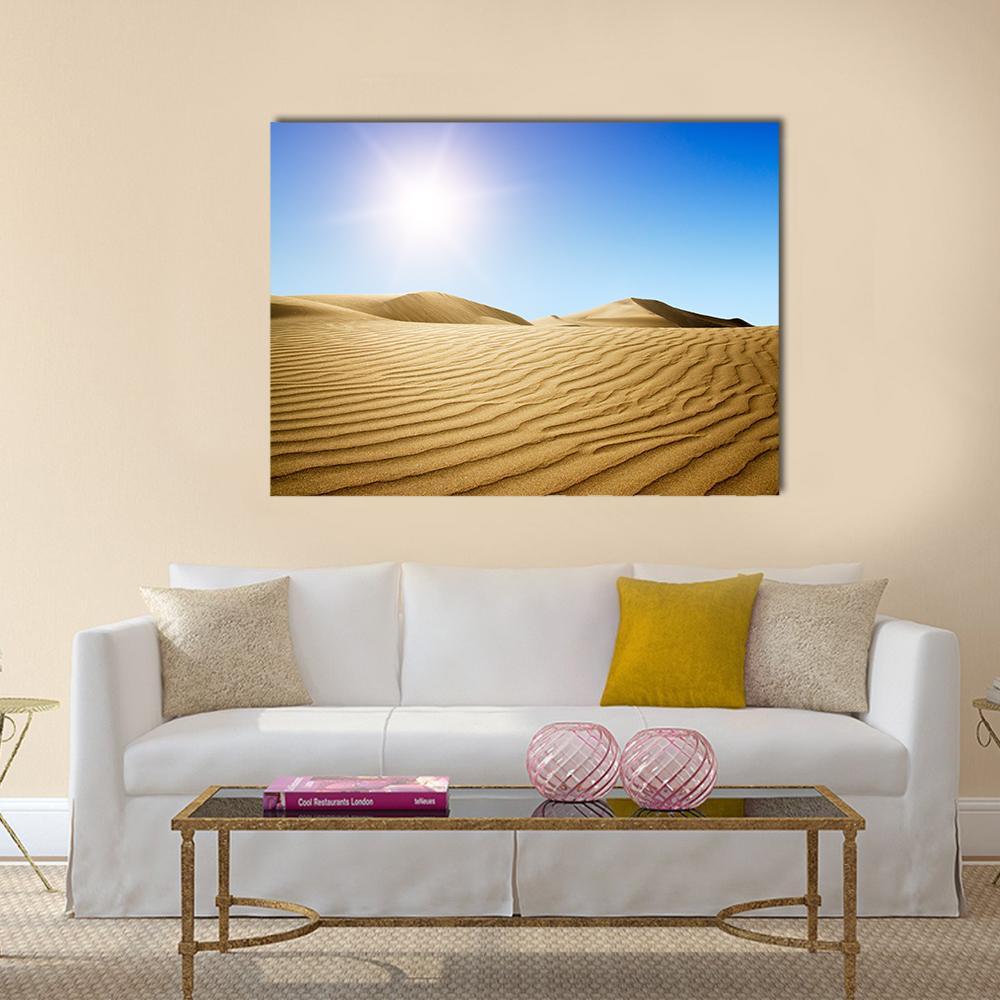 Golden Desert Dunes at Sunset Canvas Wall Art in gold, yellow and blue, single panel hung on a wall
