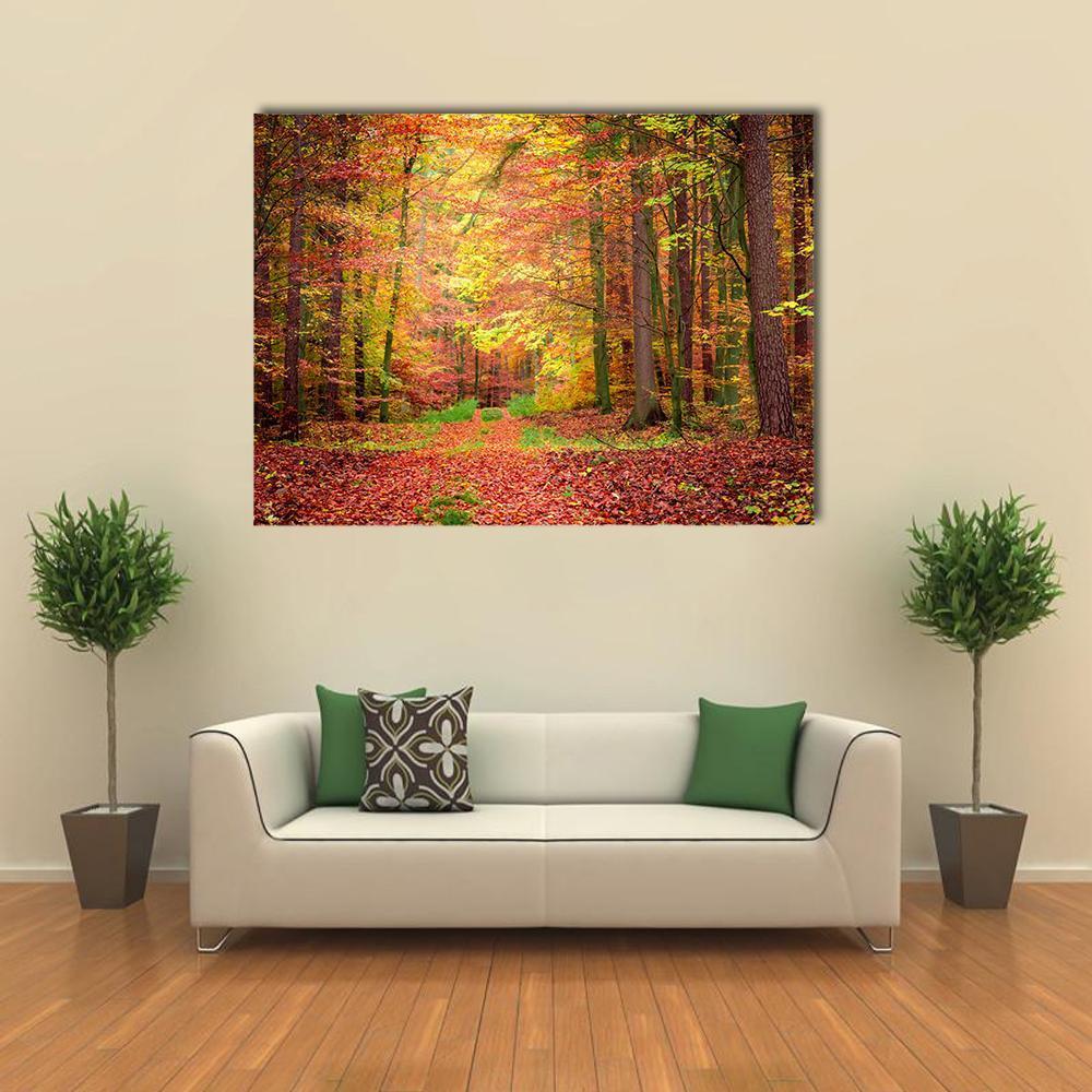Golden Green Forest Path Canvas Wall Art in gold, red and green, single panel hung on a wall