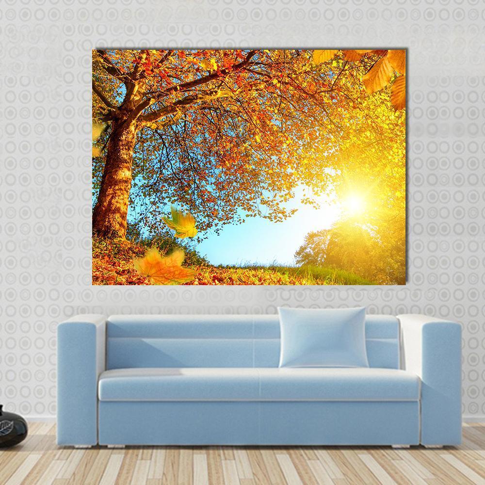 Golden Autumn Scenery Canvas Wall Art in orange, yellow and blue, single panel hung on a wall