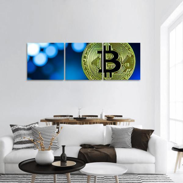 Golden Bitcoin on Keyboard Panoramic Canvas Wall Art in black, gold and blue, single panel hung on a wall