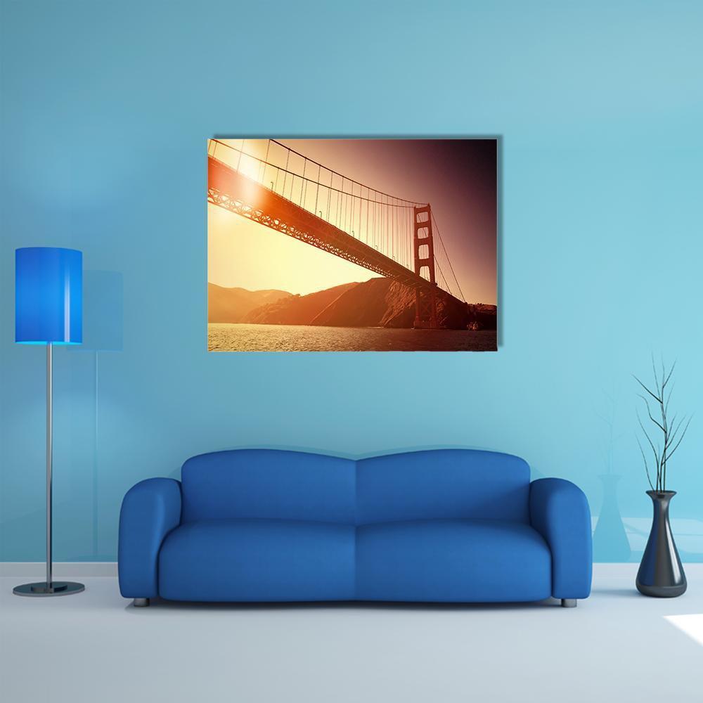 Golden Gate Bridge Over San Francisco Bay Canvas Wall Art in brown, orange and yellow, single panel hung on a wall