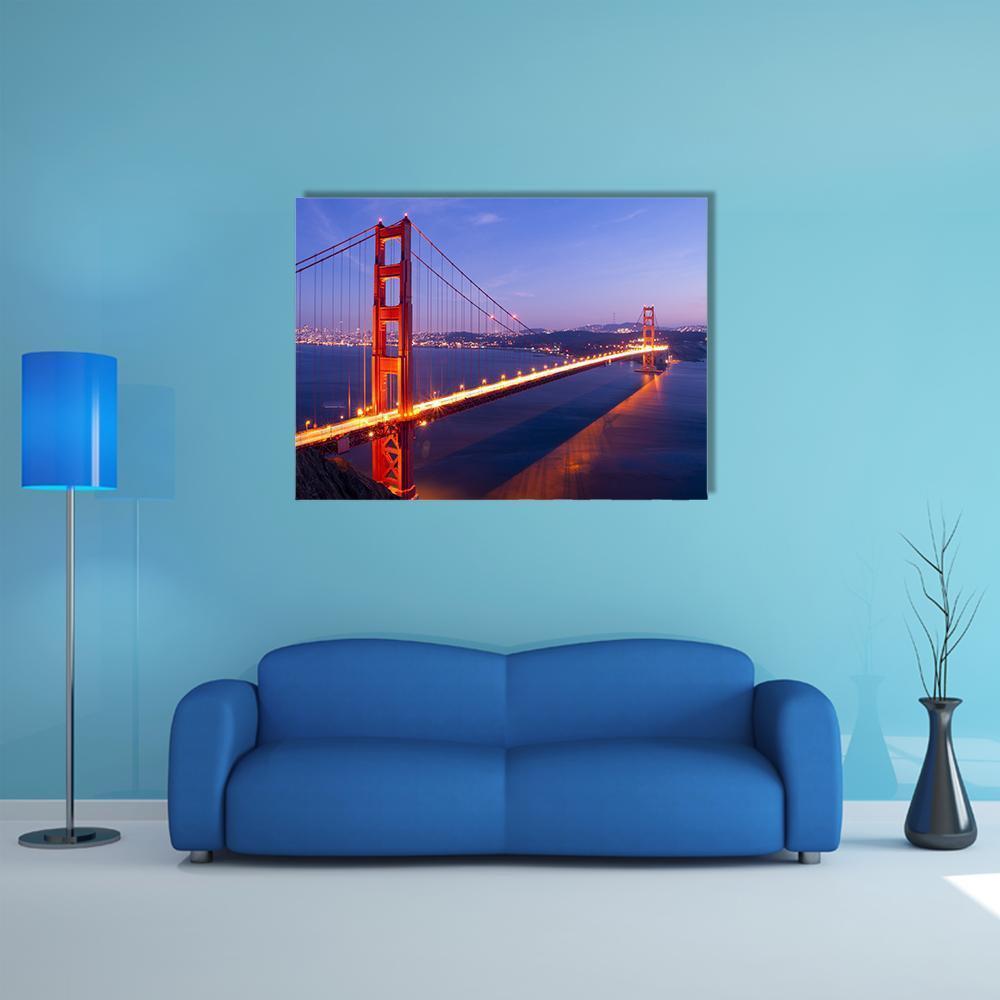 Golden Gate Bridge Night Skyline Canvas Wall Art in orange, blue and purple, single panel hung on a wall