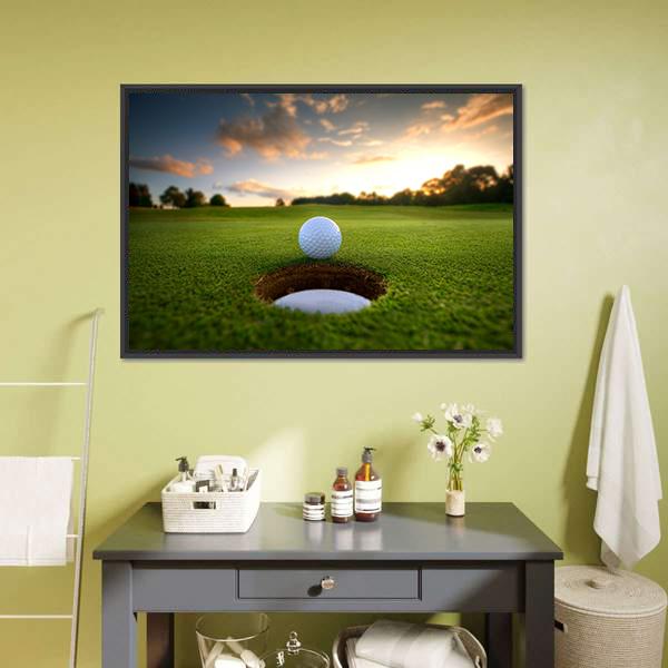 Golf Ball About to Fall Canvas Wall Art in yellow, green and blue, framed canvas, product view on a white background