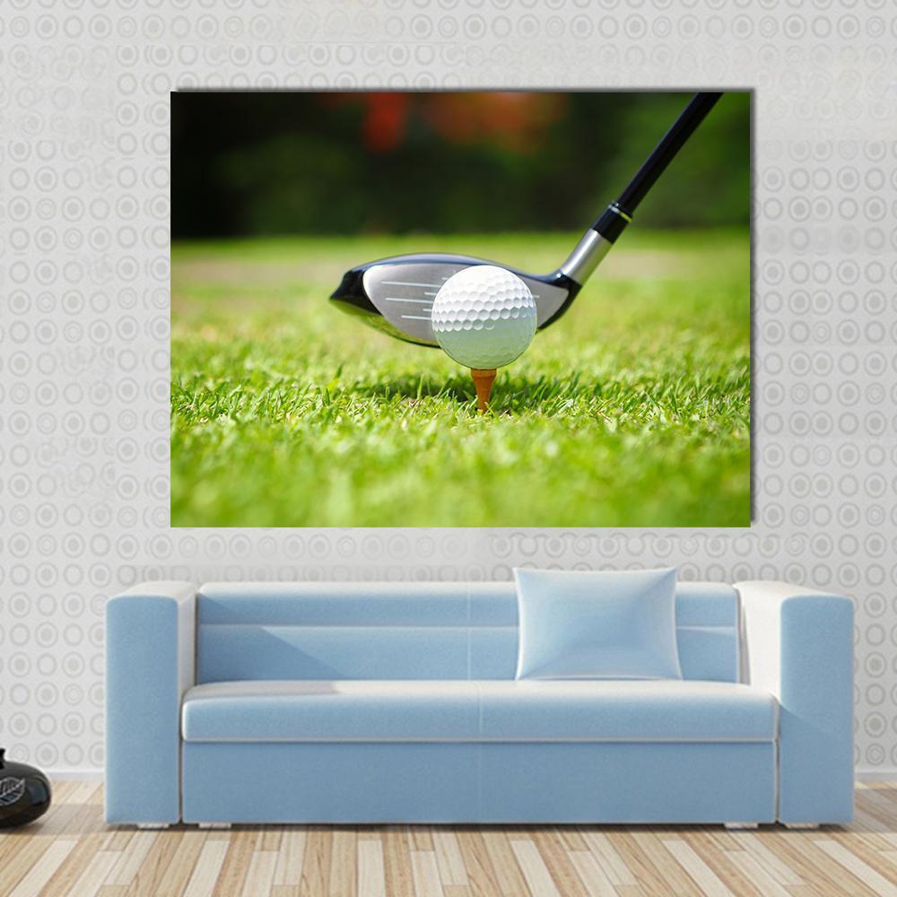 Golf Ball on Tee Close-up with Club Canvas Wall Art in black, white and green, single panel hung on a wall