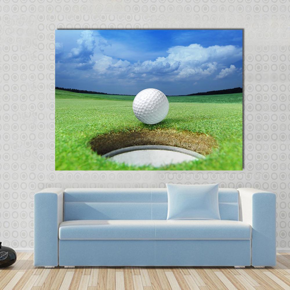 Golf Ball in Course Canvas Wall Art in white, green and blue, single panel hung on a wall