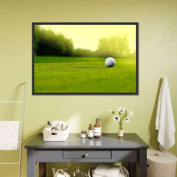 Golf Ball in the Hole Canvas Wall Art in white, yellow and green, framed canvas, product view on a white background
