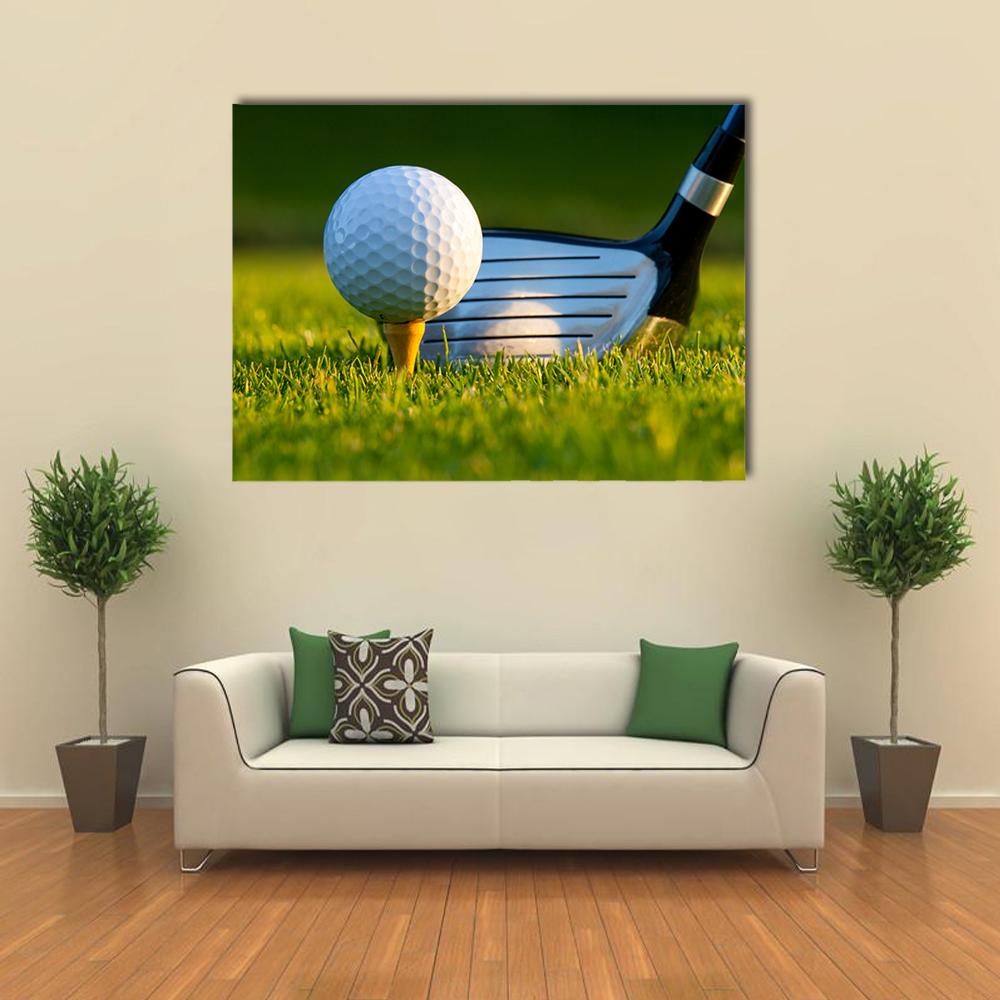 Close-up Golf Ball on Tee Canvas Wall Art in black, white and green, single panel hung on a wall