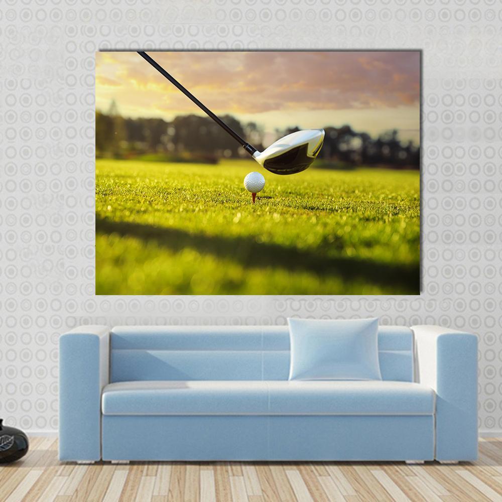 Golf Ball on Tee in Front of Driver Canvas Wall Art in white, yellow and green, single panel hung on a wall