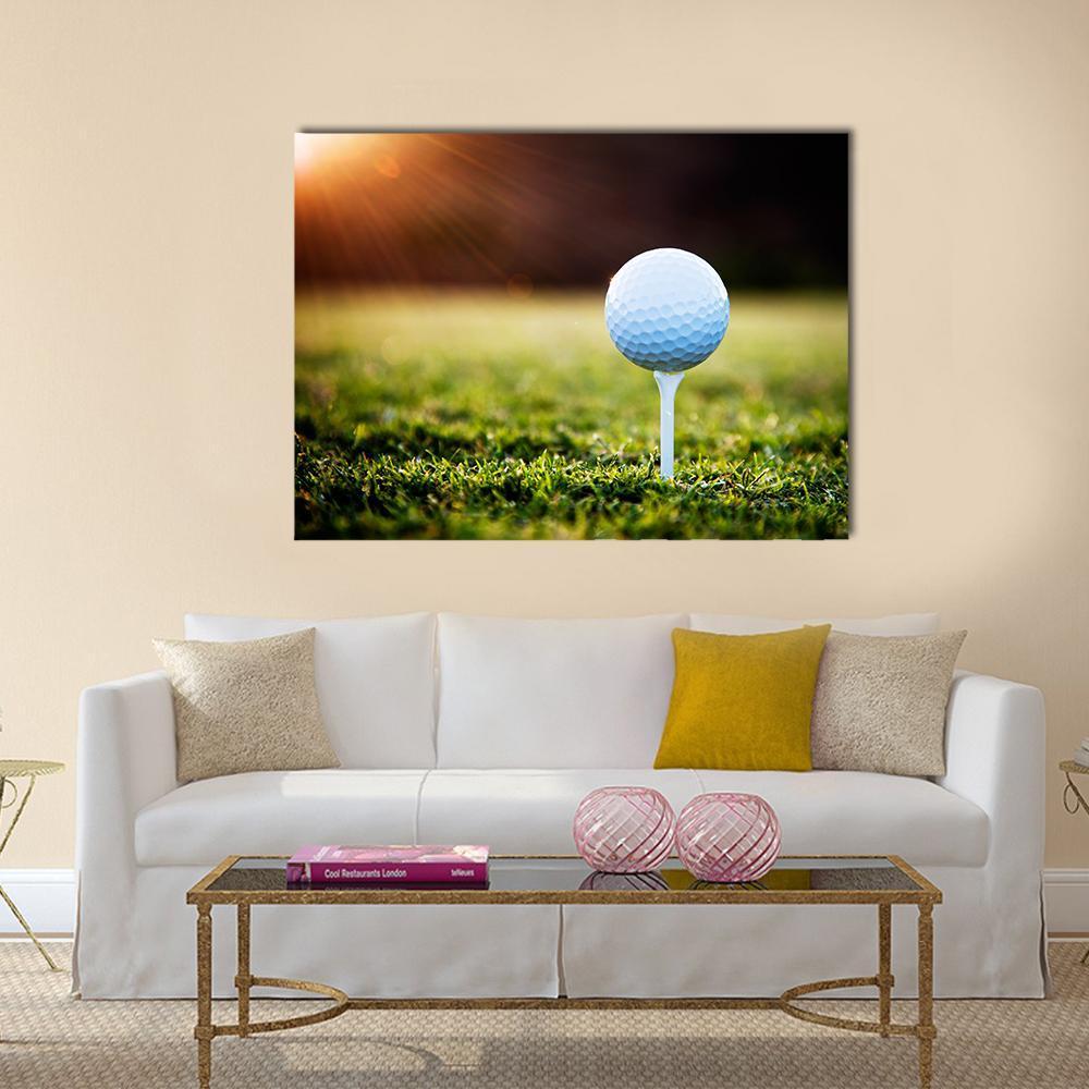 Golf Ball on Tee Canvas Wall Art in white, brown and green, single panel hung on a wall