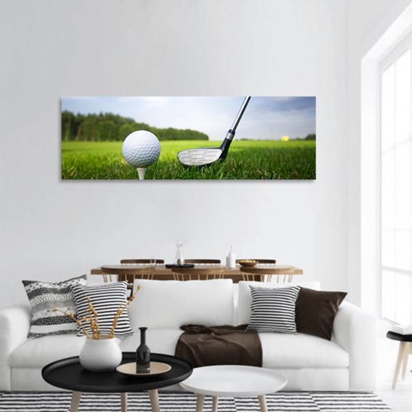 Golf Driver and Ball on Tee Panoramic Canvas Wall Art in white, green and blue, single panel hung on a wall