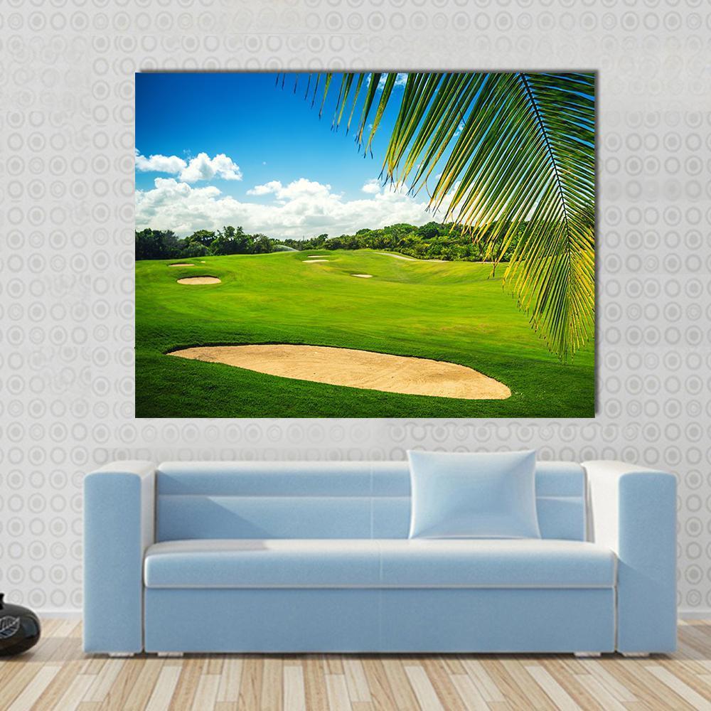 Golf Course in Punta Cana Canvas Wall Art in beige, green and blue, single panel hung on a wall