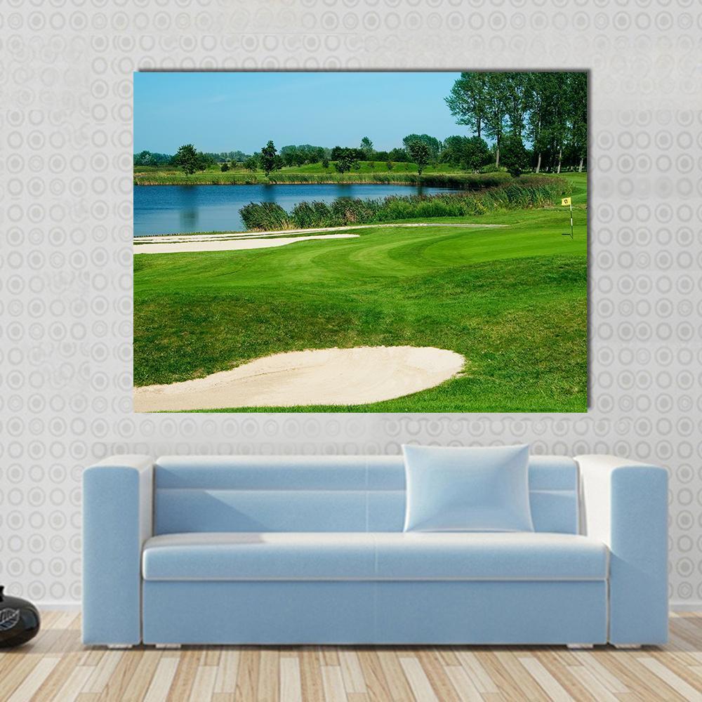 Golf Course Serenity Canvas Wall Art in beige, green and blue, single panel hung on a wall