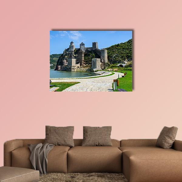 Golubac Fortress on Hillside by River Canvas Wall Art in gray, green and blue, single panel hung on a wall
