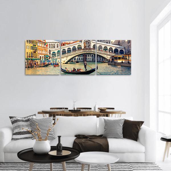 Rialto Bridge in Venice Panoramic Canvas Wall Art in white, beige and blue, hung on a wall