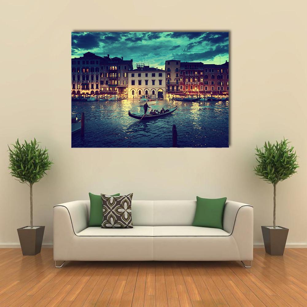 Gondola on Venice Canal at Sunset Canvas Wall Art in gold, yellow and blue, single panel hung on a wall
