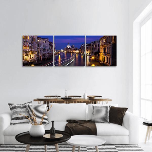Grand Canal at Night Panoramic Canvas Wall Art in yellow, blue and navy, hung on a wall