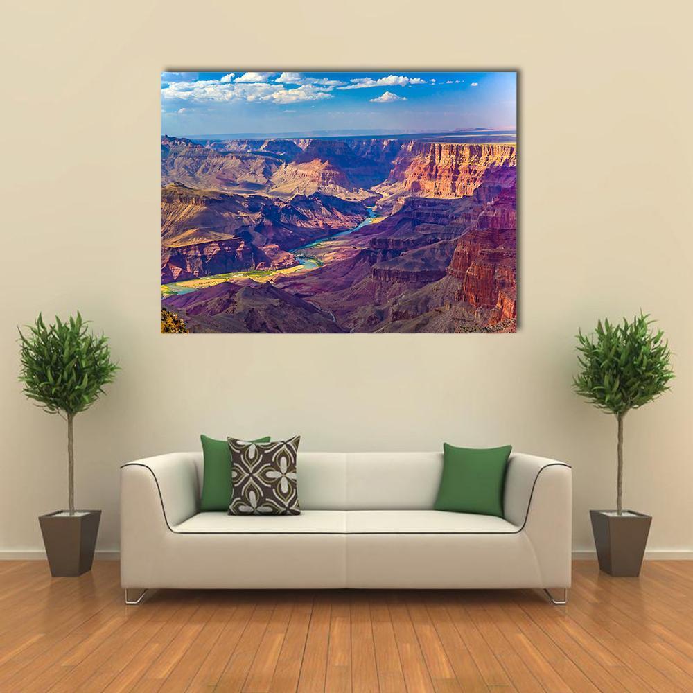 Grand Canyon with Colorado River Canvas Wall Art in brown, orange and blue, single panel hung on a wall