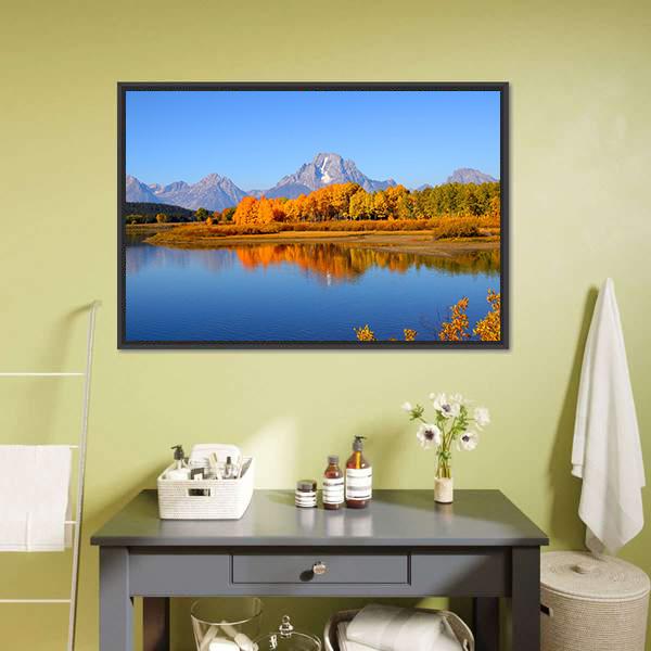 Snow-capped Mountains with Autumn Lake Reflection Canvas Wall Art in orange, yellow and blue, framed canvas, product view on a white background