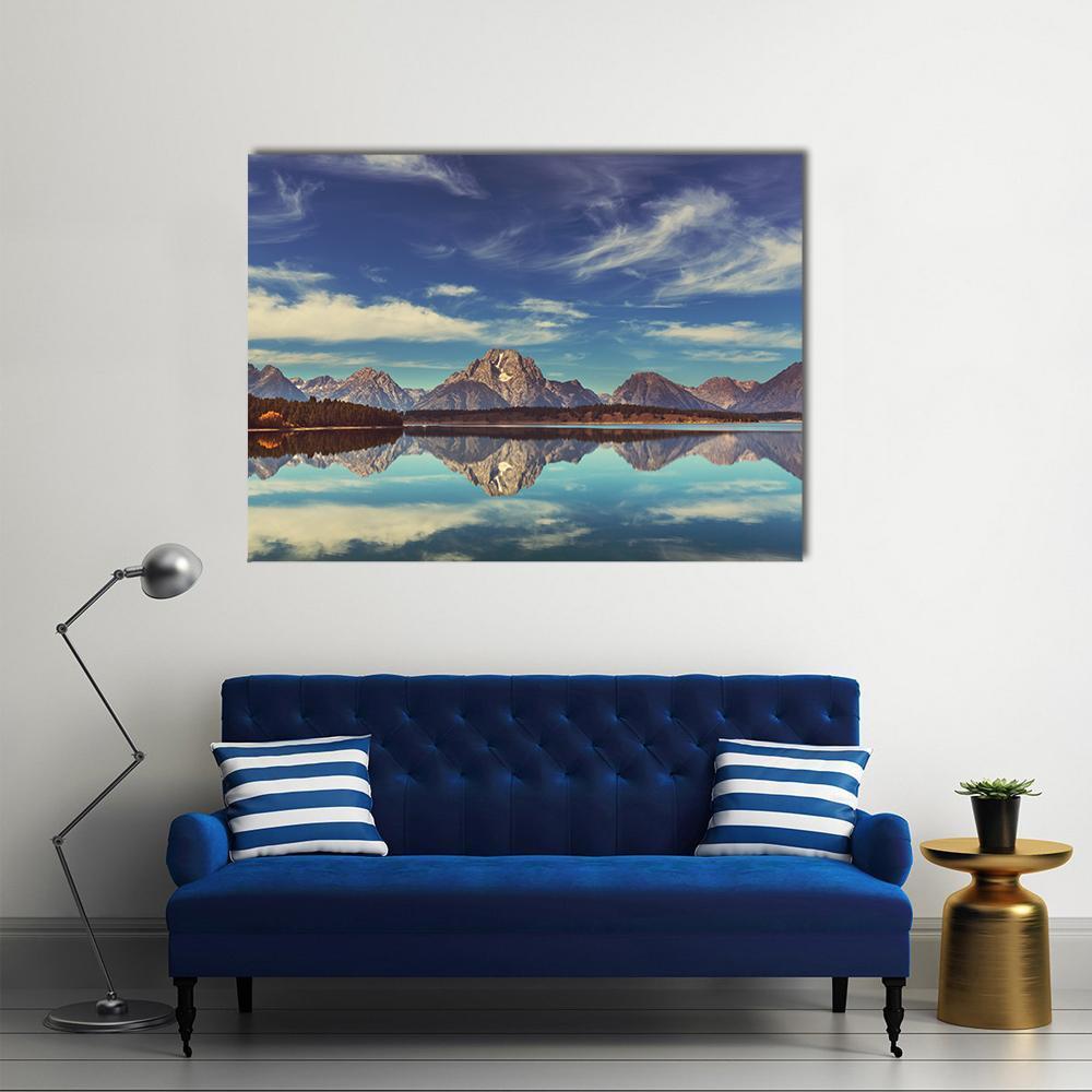 Snow-capped Mountains with Lake Reflection Canvas Wall Art in white, gray and blue, single panel hung on a wall