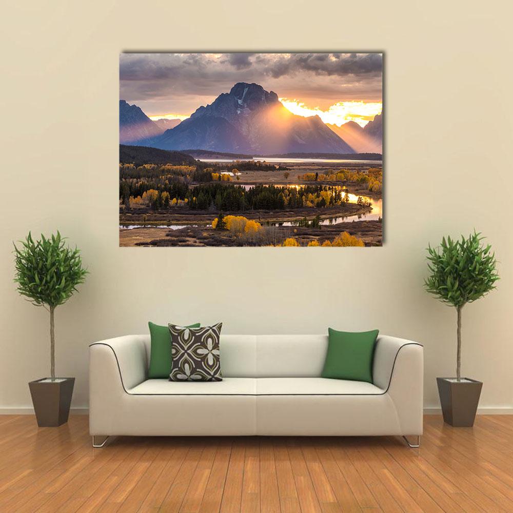 Grand Teton Sunrise Over River Valley Canvas Wall Art in orange, yellow and blue, single panel hung on a wall