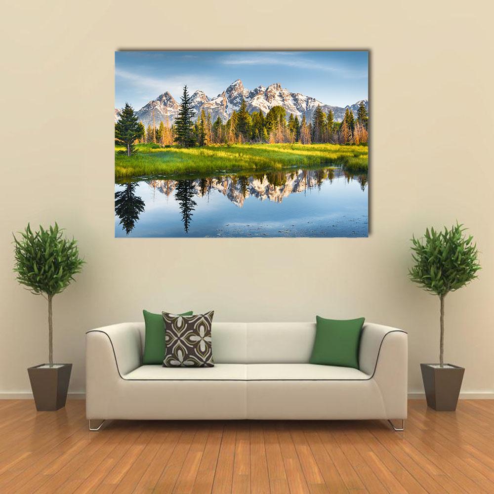 Snow-capped Peaks and Reflective Lake Canvas Wall Art in white, green and blue, single panel hung on a wall