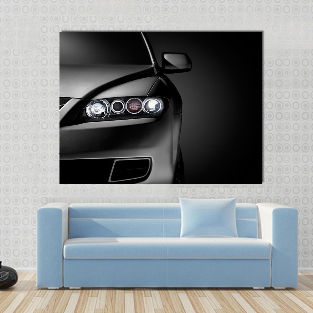 Gray Modern Car Closeup Canvas Wall Art in black and gray, single panel hung on a wall