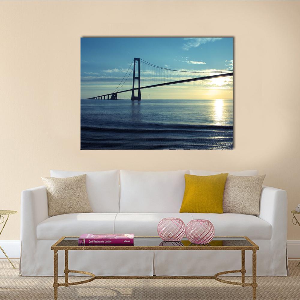 Great Belt Suspension Bridge Canvas Wall Art in yellow, blue and navy, single panel hung on a wall