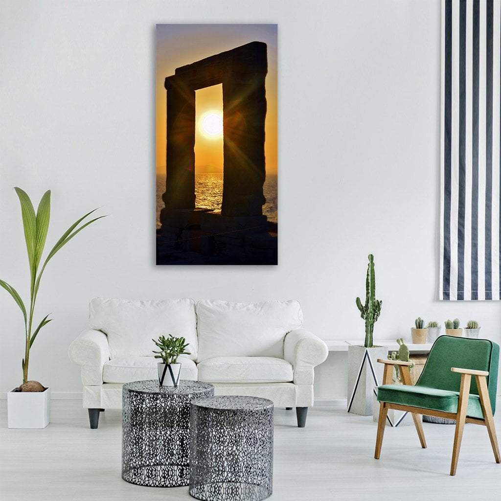 Portara of Naxos at Sunset Vertical Canvas Wall Art in black, orange and yellow, single vertical panel hung on a wall