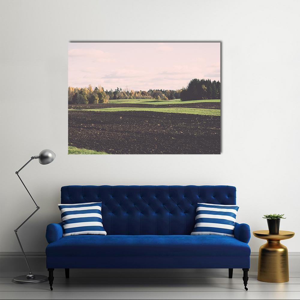 Green Field and Trees in Autumn Canvas Wall Art in gray, brown and green, single panel hung on a wall