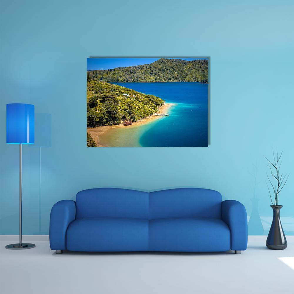 Green Forest and Blue Coastal View Canvas Wall Art in green and blue, single panel hung on a wall
