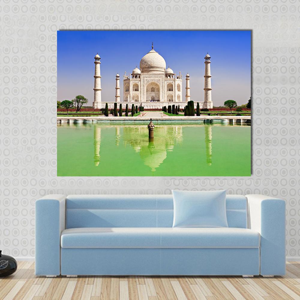 Green Pond in Front of Taj Mahal Canvas Wall Art in white, green and blue, single panel hung on a wall