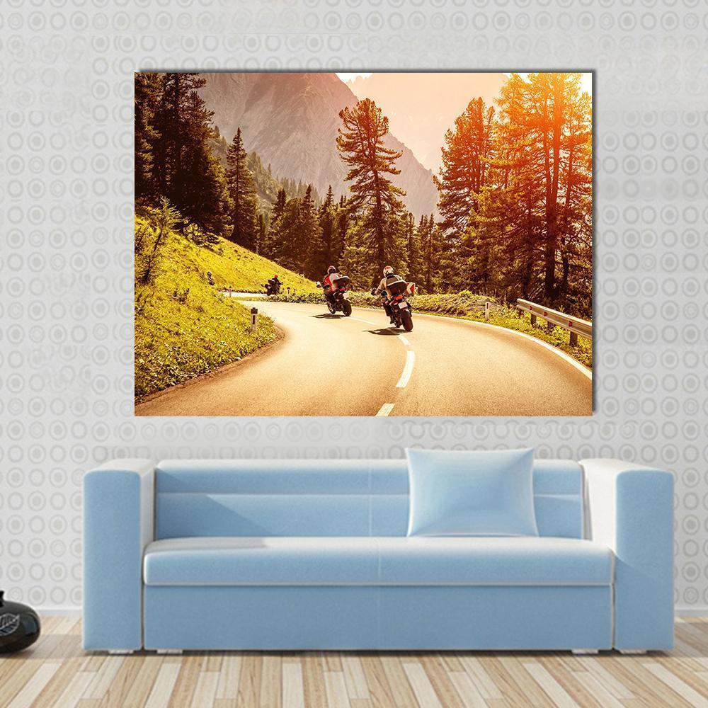 Group of Motorcyclists Canvas Wall Art in brown, orange and yellow, single panel hung on a wall