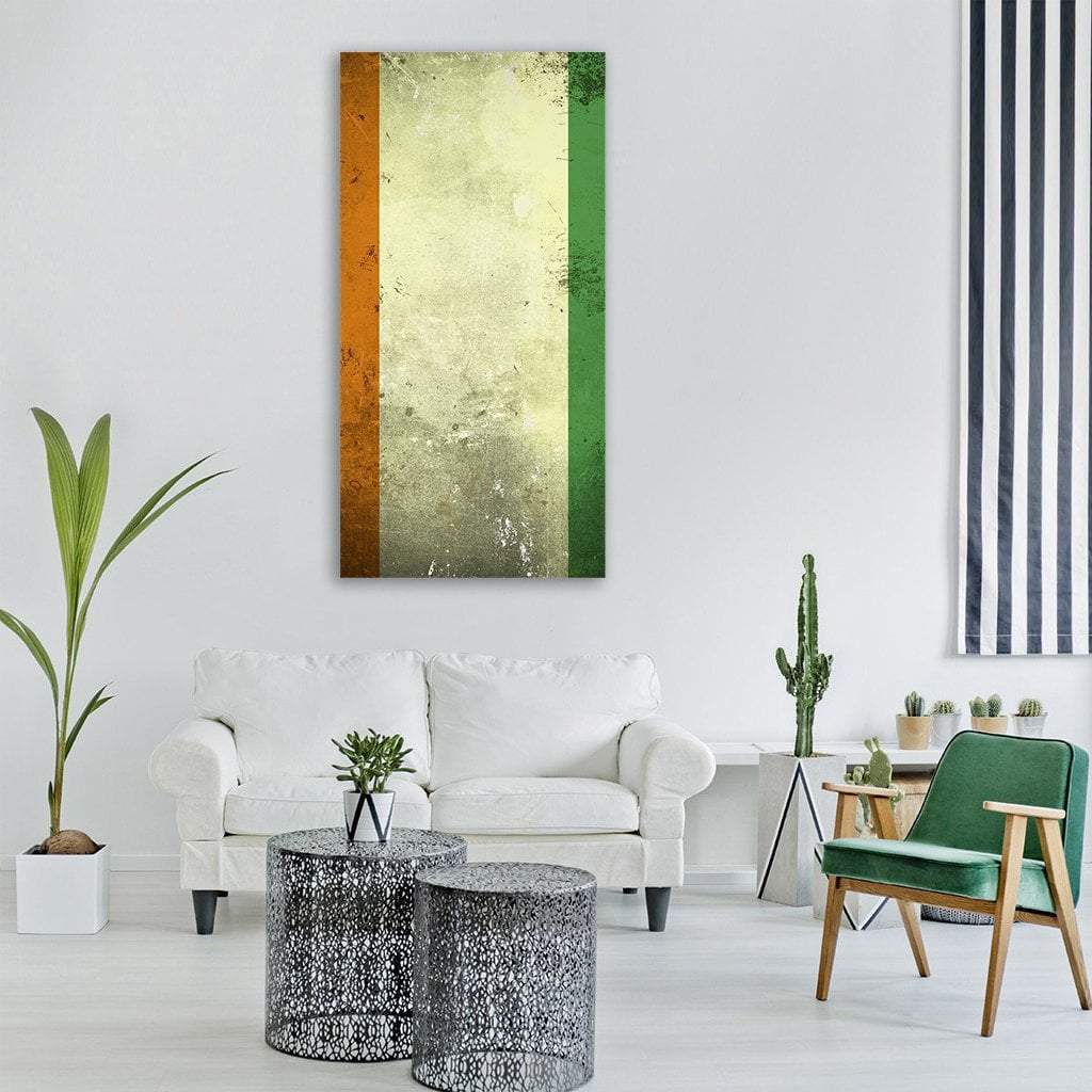 Grunge Ivory Coast Flag Vertical Canvas Wall Art in white, orange and green, single vertical panel hung on a wall
