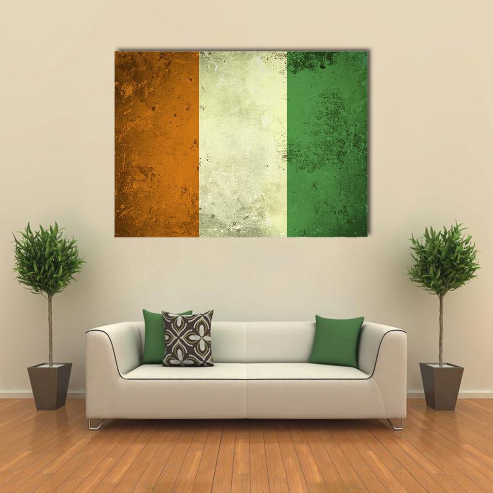 Grunge Ivory Coast Flag Canvas Wall Art in white, orange and green, single panel hung on a wall