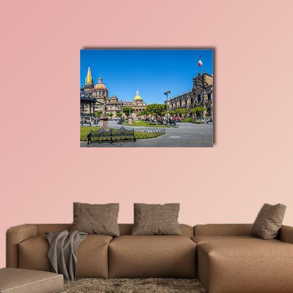 Guadalajara Cathedral Plaza Canvas Wall Art in gray, beige and blue, single panel hung on a wall