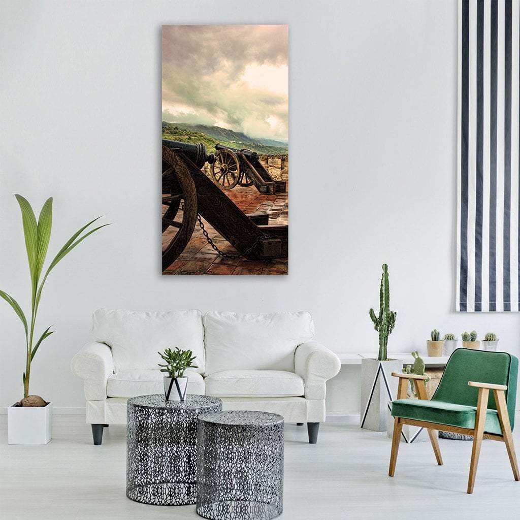 Old Castle Cannons on Stone Vertical Canvas Wall Art in gray, beige and brown, single vertical panel hung on a wall
