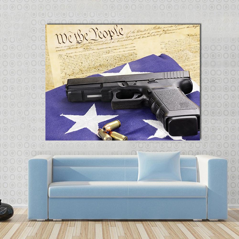 Gun on Folded Flag Canvas Wall Art in black, beige and blue, single panel hung on a wall