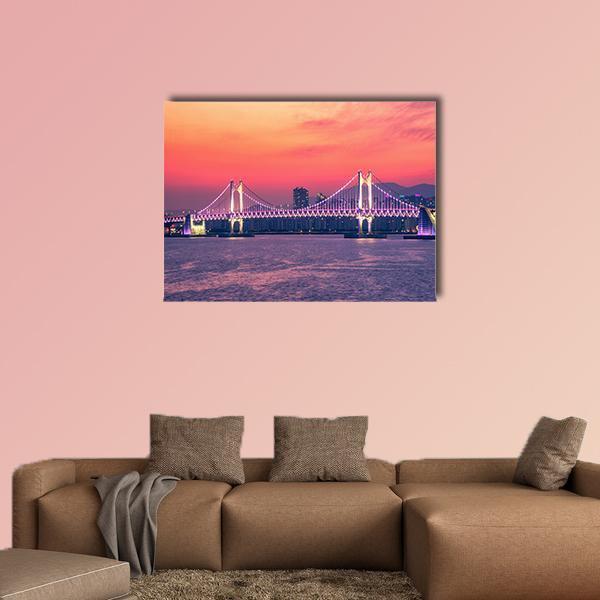 Gwangan Bridge with Purple Lights, Busan Canvas Wall Art in orange, purple and pink, single panel hung on a wall