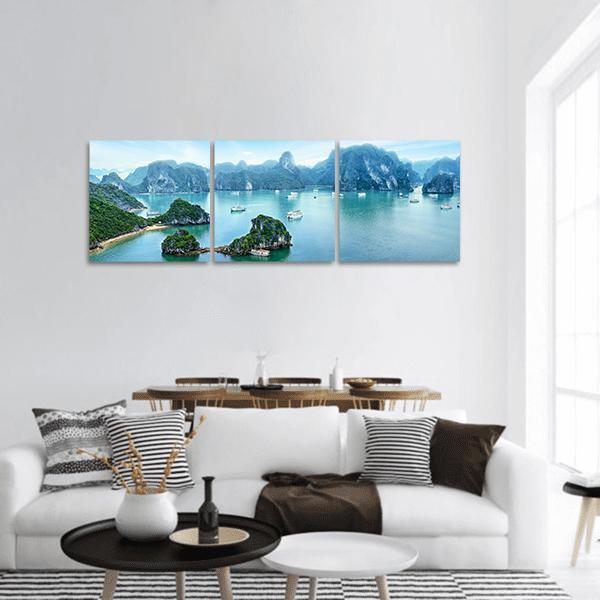Ha Long Bay Emerald Waters and Limestone Karsts Panoramic Canvas Wall Art in green and blue, hung on a wall
