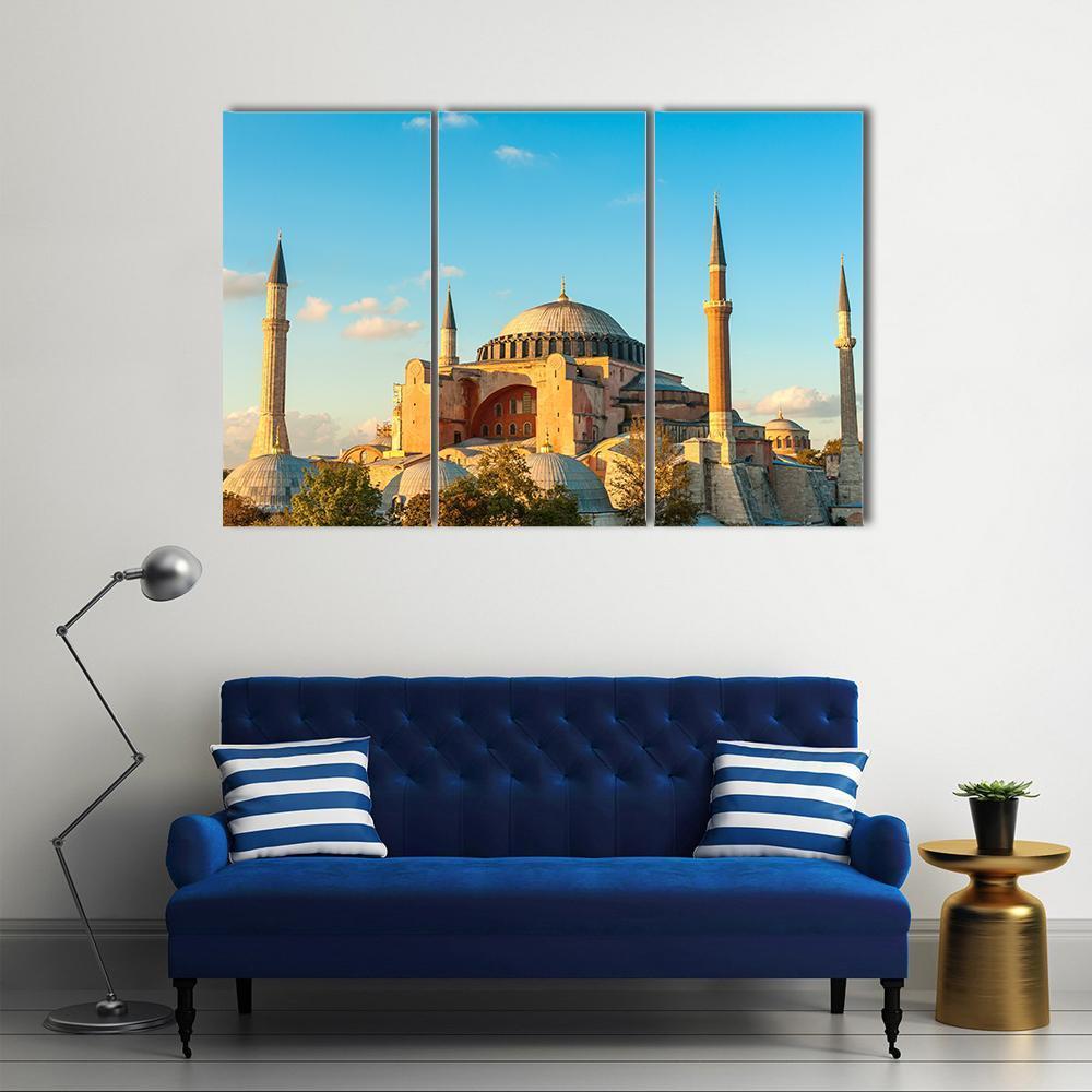 Hagia Sophia Under Sunny Blue Sky Canvas Wall Art in beige, orange and blue, 3 panel horizontal set hung on a wall