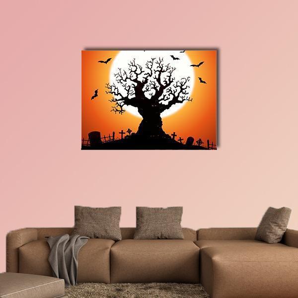 Gnarled Tree and Graveyard at Full Moon Canvas Wall Art in black, orange and yellow, single panel hung on a wall