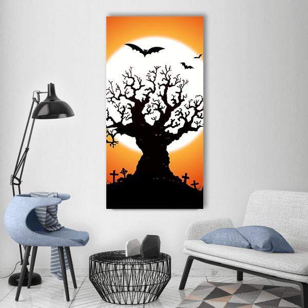 Gnarled Tree and Full Moon Silhouette Vertical Canvas Wall Art in black, white and orange, single vertical panel hung on a wall