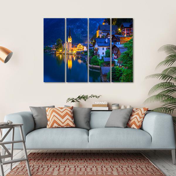 Hallstatt Village at Dusk Canvas Wall Art in yellow, blue and navy, hung on a wall