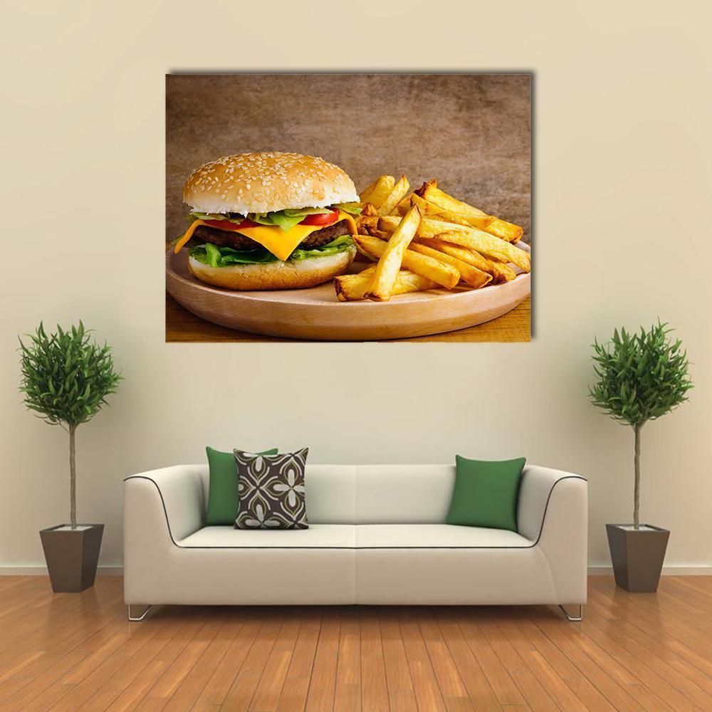 Cheeseburger and Fries on Wooden Plate Canvas Wall Art in beige, brown and yellow, single panel hung on a wall