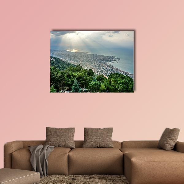 Sunbeams Over Coastal Cityscape Canvas Wall Art in gray, green and blue, single panel hung on a wall